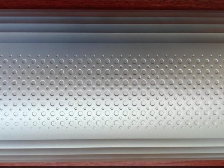 Translucent cylindrical energy storage housing with perforated texture band
