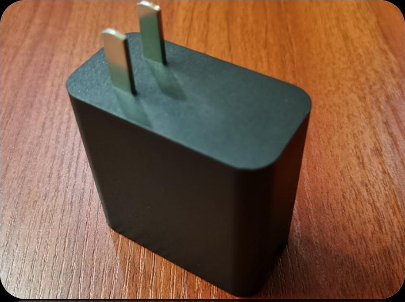 Black fast-charge adapter housing with two pins and a wedge-shaped body
