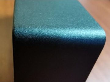 Close-up of a molded housing corner showing the fine surface texture
